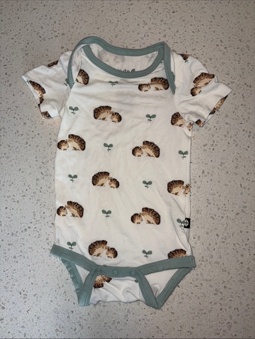 Kyte Baby Hedgehog Print One-Piece Bodysuit in Cream and Sage 0-3m
